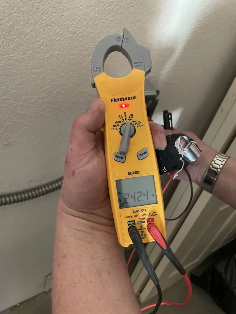 Voltage testing with clamp meter during Recessed Lighting Installation in Lawrenceburg